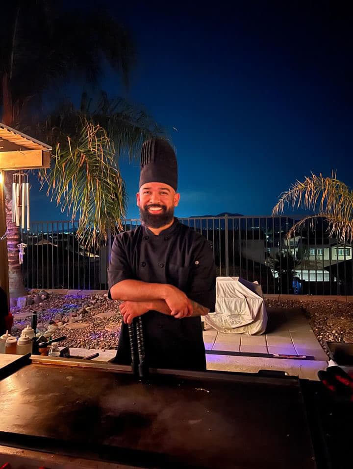 Corporate hibachi event with chef performing for guests